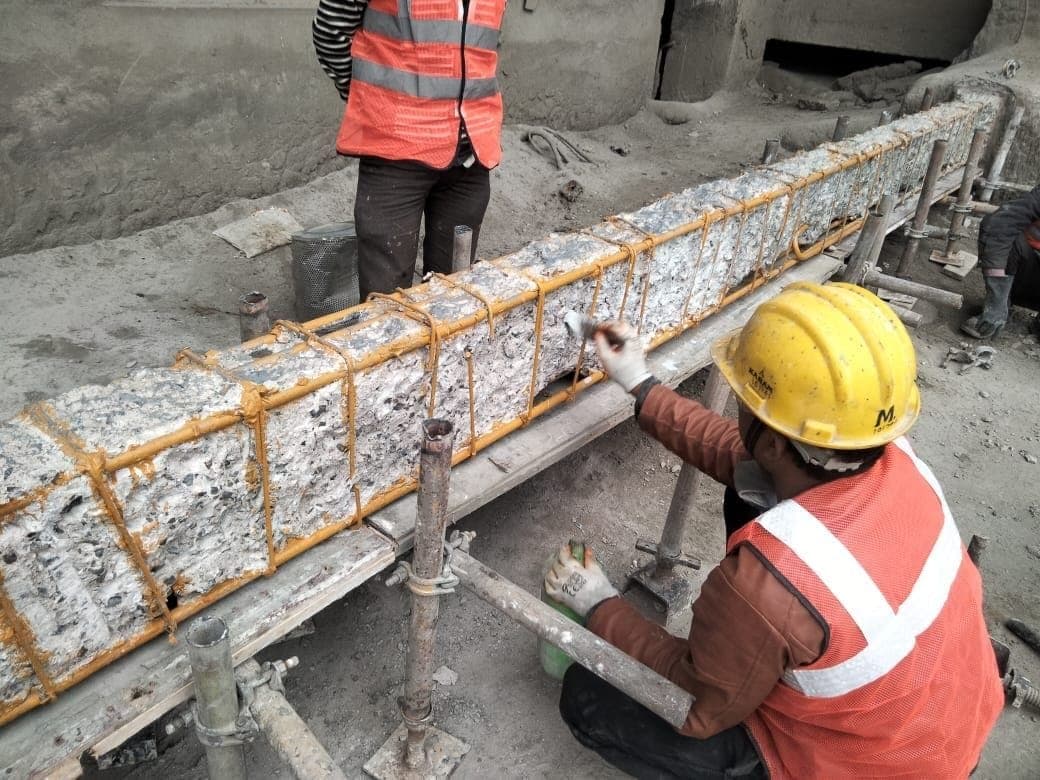 R.P. Pataskar crew applying repair mortar on-site